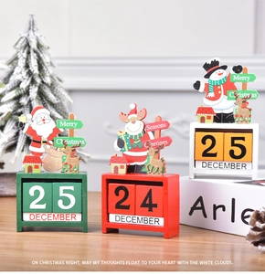 Macro detail of wooden Christmas advent calendar with reindeer figure and manual date blocks