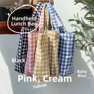 Detailed stack of cotton linen gingham lunch bags in five soft pastel colors with handles