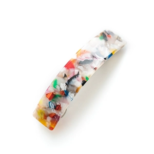 Elegant rectangular acetate hair clip with colorful tortoiseshell pattern on white background