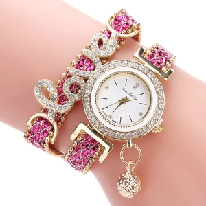 Pink bohemian wrap watch with gold finish, rhinestone LOVE charm, and sphere pendant
