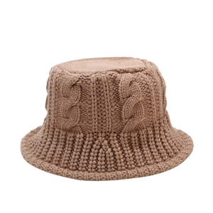 Brown knit bucket hat for women featuring a thick cable knit pattern and warm wool texture