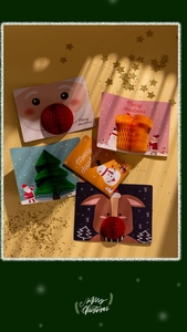 Detailed view of 3D Christmas cards with honeycomb patterns and festive glitter decor
