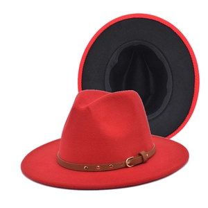 Detail view of red fedora hat with two-tone black interior and studded leather band