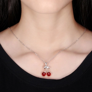 Elegant S925 sterling silver cherry pendant necklace worn on female model neck