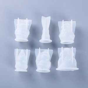 Macro detail of 6-piece Christmas silicone molds for DIY resin candles and soap crafts