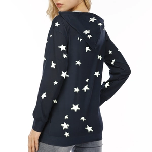 Detail view of the star print pattern on the back of a dark blue hooded sweatshirt