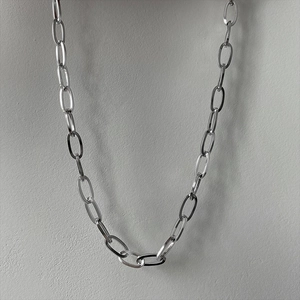 Polished silver chunky metal chain necklace with large oval links in minimalist style