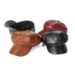 Detailed set of leather baker boy hats in black, brown, wine red, and grey on white background