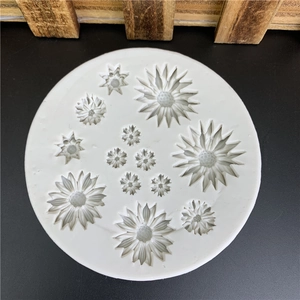 White silicone daisy mold for DIY cake fondant and resin crafts with multiple flower sizes