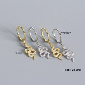 Macro detail of snake hoop earrings showing scale texture and size measurements