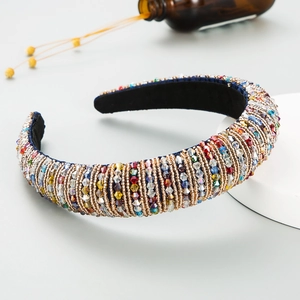 Close-up of bohemian padded headband with colorful crystals and handmade beadwork details