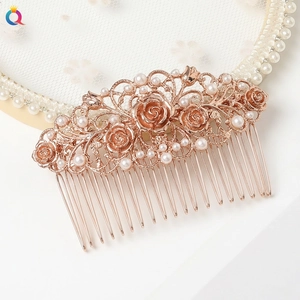 Detail of silver alloy hair comb with twelve carved leaf textures for wedding