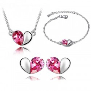 Elegant silver heart jewelry set with pink crystal necklace, bracelet, and stud earrings