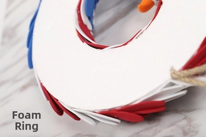 Detail of decorative foam ring base with red white and blue eagle wreath accents