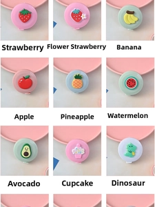 Detailed grid of mini round tape measures with cute fruit patterns like strawberry and avocado