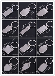 Detailed technical view of diverse metal keychains with measurements and silver finish