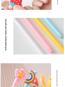 Detail of colorful cartoon gel pens featuring 3D strawberry and rainbow silicone ornaments