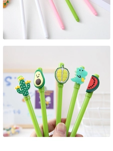 Detailed view of cute cartoon gel pens with unique silicone cactus and avocado toppers