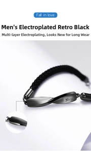 Macro detail of the Mobius silver bracelet with No.52 engraving and black braided cord