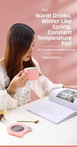 Pink cat-shaped smart cup warmer detail showing 55 degree constant heating and touch button