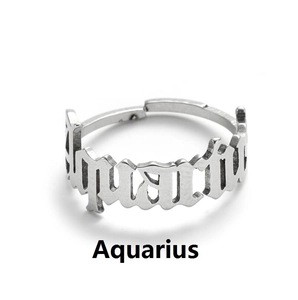 Detail of silver Aquarius zodiac ring featuring hollow lettering and adjustable open band