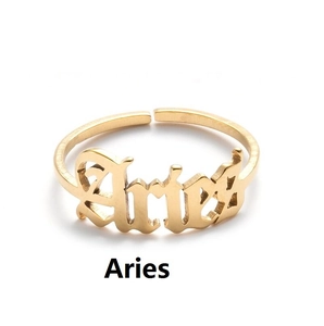 Macro view of adjustable golden Aries letter ring with polished vintage finish