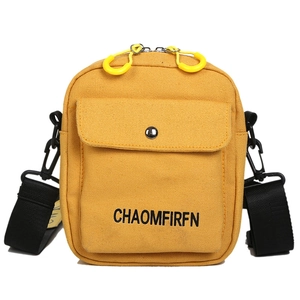 Japanese minimalist yellow canvas crossbody phone bag with front pocket and zipper closure