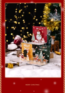 Close-up of 3D Christmas pop-up card set featuring snowman, bear and reindeer designs