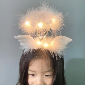 White feather angel wing headband with glowing LED lights for festive hair accessory