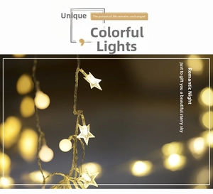 Close-up of warm white star and ball LED fairy lights with soft bokeh background