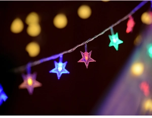 Close-up of colorful star-shaped LED fairy lights with vibrant multicolor glow