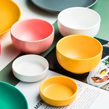 Flat lay of cute ceramic strawberry and watermelon bowls in various pastel colors