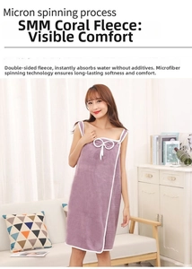 Detail of purple coral fleece bath towel dress with white wavy trim and bow accent