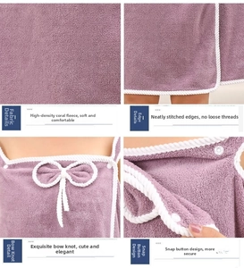 Detail view of purple coral fleece bathrobe showing bow decoration and snap closure