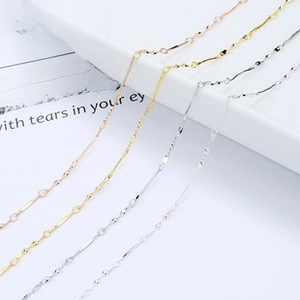 Macro shot of fine S925 sterling silver snake chains in rose gold, gold and silver