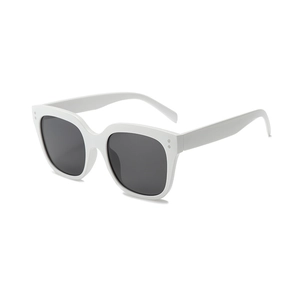 Retro oversized white sunglasses with dark grey lenses and silver stud accents