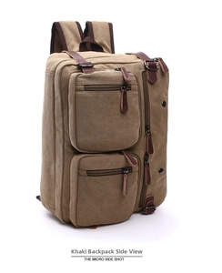 Macro side view of khaki canvas backpack with leather pulls and multiple zip pockets