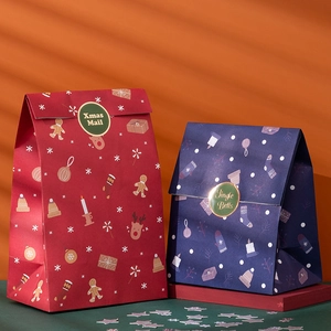 Christmas paper gift bags in red and blue with festive Xmas Mail and Jingle Bells prints