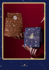 Close-up of Christmas gift paper bags with festive patterns and Happy New Year stickers