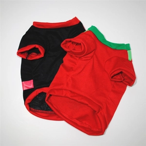 Detailed view of two-pack Christmas dog t-shirts with breathable red and green cotton fabric