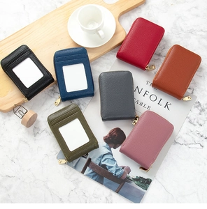 Flat lay of minimalist lychee pattern leather card holders in seven diverse elegant colors