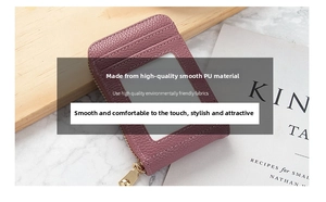 Detail of purple lychee textured PU leather wallet with a clear ID window and gold zipper