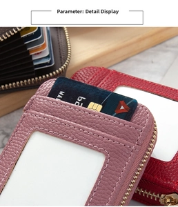 Close-up of pebble leather card holder showing multiple slots and zipper pocket
