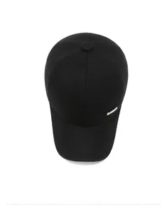Top-down view of a black cotton baseball cap with ear flaps and silver metal detail