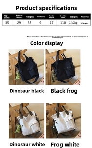 Detail view of canvas tote bag showing dual front pockets and plush toy accessories