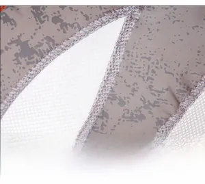 Detailed macro view of high-quality stitching on quick-dry fabric and white mesh panels