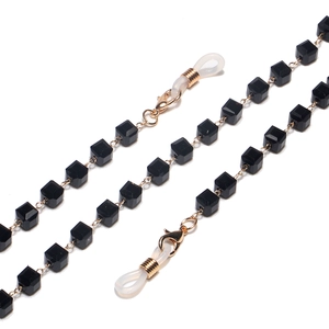Golden eyewear chain featuring black faceted crystal beads and secure silicone loops
