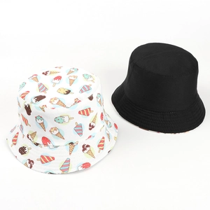 Detail of reversible sun bucket hat with colorful ice cream prints and solid black design