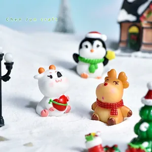 Miniature Christmas resin figurines set featuring cute reindeer, calf and penguin