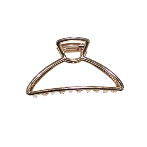 Minimalist gold metal shark hair claw clip with geometric hollow design for women